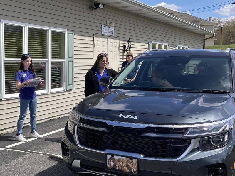 Penn State DuBois OTA students Emily Busija, center, and Maddie Barsh, right, work through a CarFit session as Amy Fatula, assistant teaching professor, watches on at the health and wellness fair at Christ the King Manor on April 25.